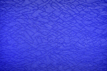 Fragment of blue fabric with abstract pattern as background
