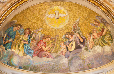 NAPLES, ITALY - APRIL 22, 2023:  The mosaic of Holy Spirit among the angels with the music instruments in the church Basilica dell Incoronata Madre del Buon Consiglio from 20. cent.