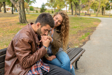 Handsome young man is kissing his girlfriends hand. Romantic moment