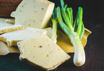 Homemade brynza with garlic, garlic and onions