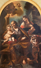 NAPLES, ITALY - APRIL 22, 2023:  The painting of Holy Family in the church Basilica dell Incoronata Madre del Buon Consiglio by Domenico Guarino (1736).