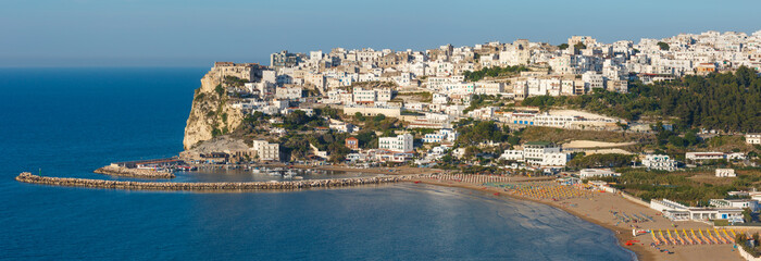 Summer sea perched Peschici beautiful town view, Gargano peninsula in Puglia, Italy. People...