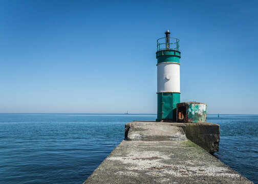 Old lighthouse in the cargo port and container terminal in Odessa, Ukraine