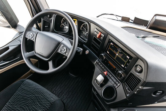 view inside the cabin of a heavy new modern truck. steering wheel, navigation system, cameras, multimedia