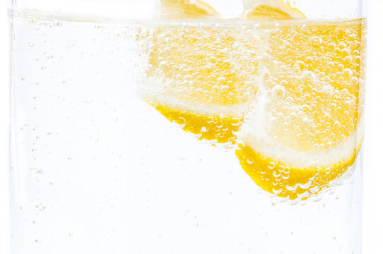 Two slices of fresh lemon in lemonade.