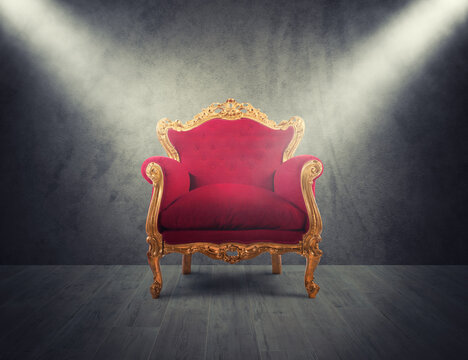 Concept of luxury and success with red velvet and gold armchair. concept of success and glory