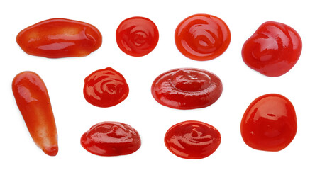 Set of different ketchup smears on white background