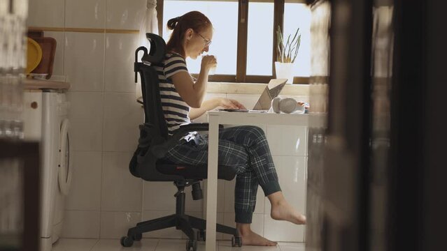 Home office - young woman doing freelance work 