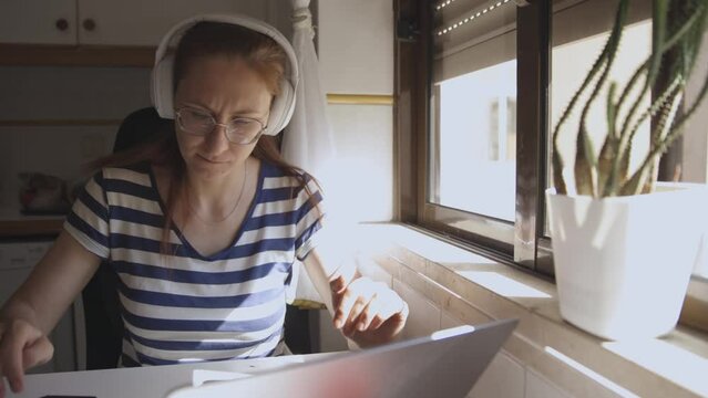 Freelance, woman doing work at home using laptop
