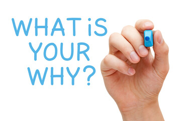 Hand writing a question What Is Your Why with blue marker on transparent wipe board.