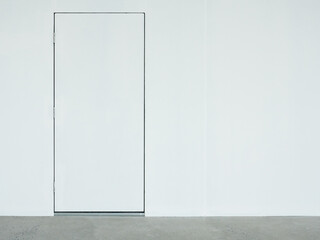 A closed white door on the white wall which located on the back side of the  warehouse.