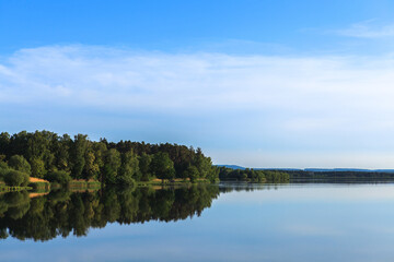 Lake Roth in Bavaria at sunset of a summer day with the outburst of a blue sky