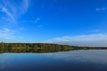 Fototapeta premium Lake Roth in Bavaria at sunset of a summer day with the outburst of a blue sky