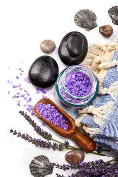 Spa still life with black stone and lavender salt isolated on white background