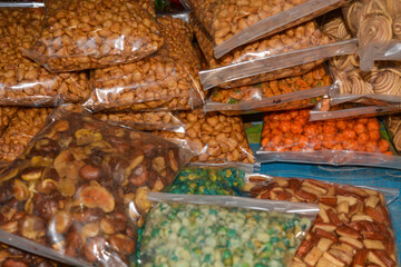 Scene view of piles of market snacks lined up. No people.