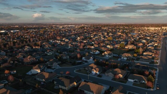 Drone shot of the sun setting over a suburban neighborhood in Kennewick, Washington.