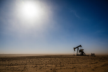 Fototapeta na wymiar oil drilling in a dust storm