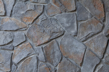 Gray and orange flagstone wall texture background