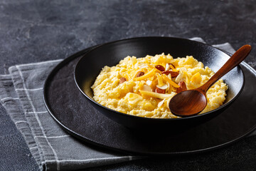 corn grits with butter, vegan cheese, and almonds