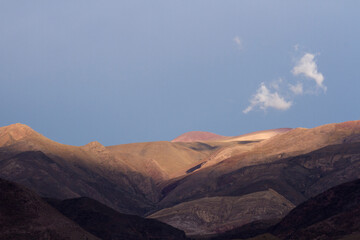 High in the mountains. The Andes cordillera at sunrise. Beautiful rock texture and morning colors and contrast.