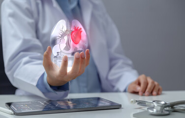 Doctor examining heart with hologram in hand. The concept of using modern technology to help...