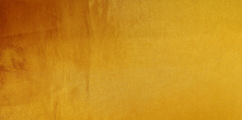 Gold silk texture background. Yellow shiny gold fabric sheet surface with light reflection, vibrant...