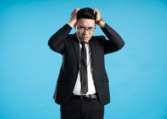  image of young businessman posing on blue background