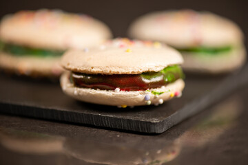 Delicious French sweet vanilla macaron with a velvet rainbow ganache.