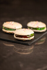 Delicious French sweet vanilla macaron with a velvet rainbow ganache.