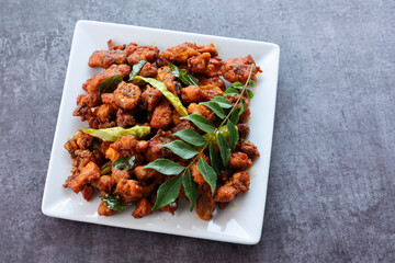 Fried chicken Kebab or Kabab, Chicken Tikka Masala dark black background Bangalore Hyderabad South India. Top view of Indian non veg food.