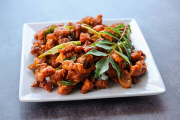 Fried chicken Kebab or Kabab, Chicken Tikka Masala dark black background Bangalore Hyderabad South India. Top view of Indian non veg food.