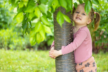 toddler hugs tree, kids love nature, summer outdoor activity