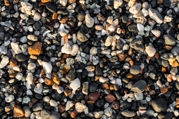 Small pebble background with many colors at a beach.  Geology, minerals.