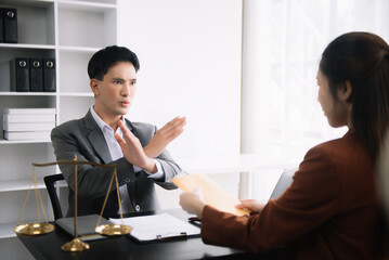 Lawyer refusing bribe money in the envelop from business man at the lawyer office...