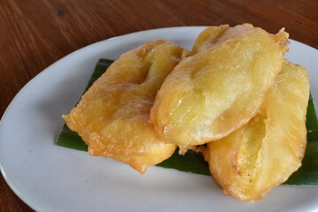 Fried bananas served in white plate