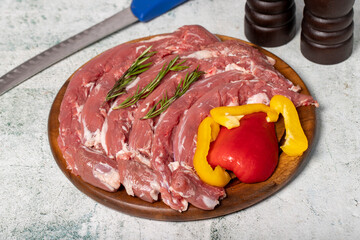 Lamb tenderloin or mutton sirloin. Fresh raw lamb tenderloin on a wood serving board
