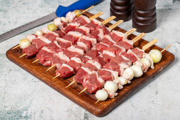 Lamb skewered meat. Barbecue meat made from lamb leg on a wooden presentation board