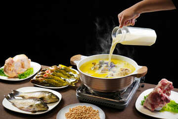 boiled fish with soya bean milk, Chinese Hunan specialties, soy milk and grass carp,indoor shot, dark background