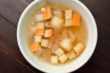 Wedang Ronde, Javanese traditional drink. Served with ginger soup, coconut flesh and glutinous riceball with peanut inside.