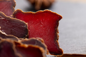 dried red beef meat on the kitchen table