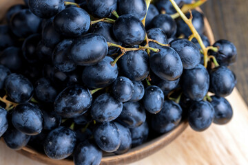 Unwashed blue grapes in the dust