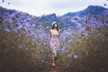 Traveler asian woman travel in flower garden at Khao Yai Thailand