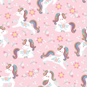 White unicorn with rainbow mane and tail. Vector seamless pattern with cute unicorns on a pink floral background