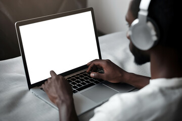Person listening to music on laptop black and white image Tone