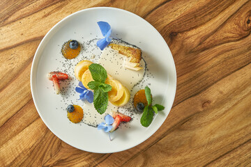 Cheesecakes with fruit and jam in a white plate. Vegetarian food. syrnyky