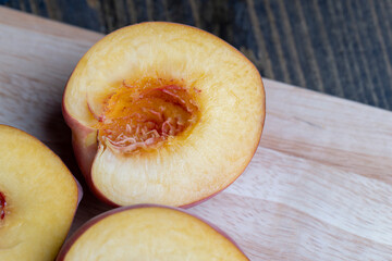 Ripe fresh peaches on a wooden table