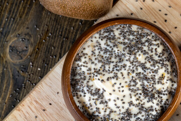 yogurt with the addition of pieces of ripe yellow kiwi with chia and popcorn