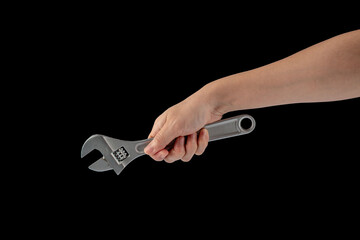 A wrench in hand isolated on black background.