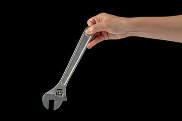 A wrench in hand isolated on black background.