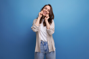 positive friendly brunette young woman in stylish look
